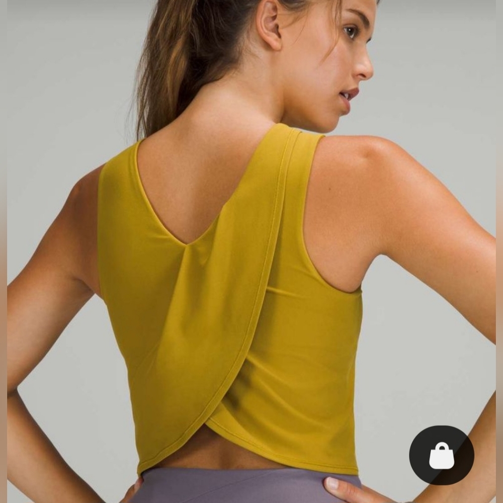 Lululemon Women’s Nulu Twist Back Yoga Tank  Color Auric Gold Sz 12